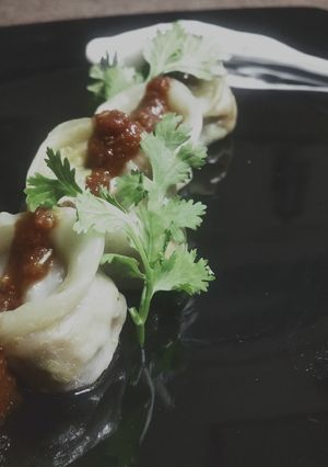 A picture of Soya Bean Ke Momos with Hot Garlic Sauce.