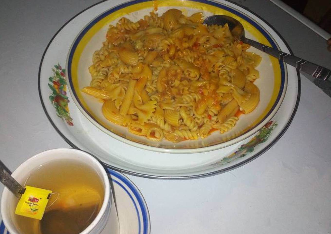 Mix macaroni jollof and black tea