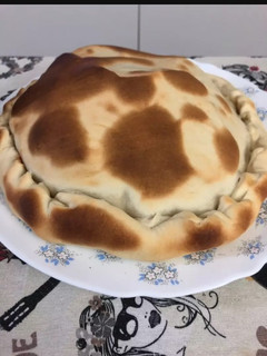 Una foto de Pizza con tapa