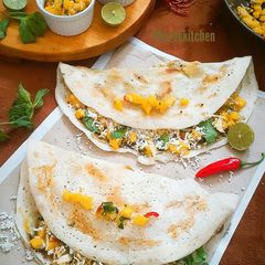 A picture of Spicy Mango salsa stuffed Dosa with Mango Sauce.