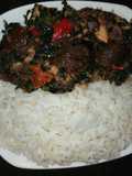 Boiled rice with vegetable sauce and snail