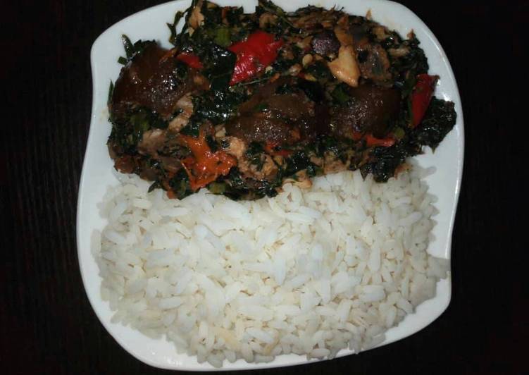 Boiled rice with vegetable sauce and snail