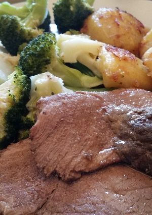 A picture of Roast beef with steamed veg and roast potatoes.