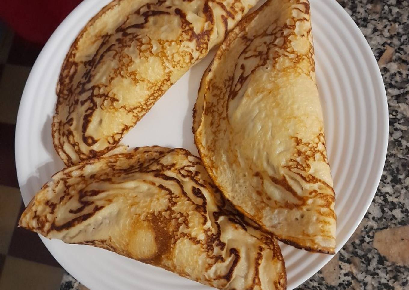 Crepas de papa rellenas con carne picada, cebolla y queso