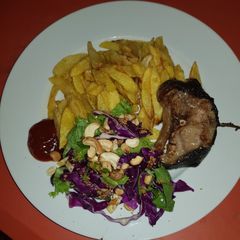 A picture of Potatoe, fish &salad.