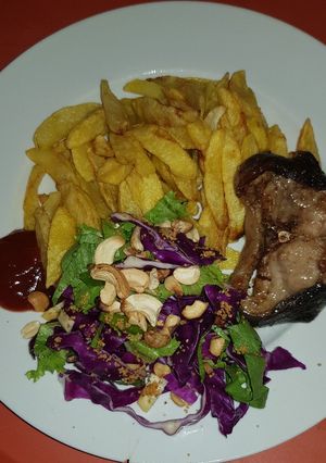 A picture of Potatoe, fish &salad.