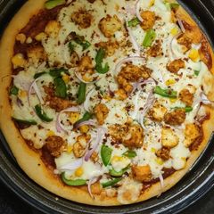 A picture of Paneer Veggie Delite Pizza.
