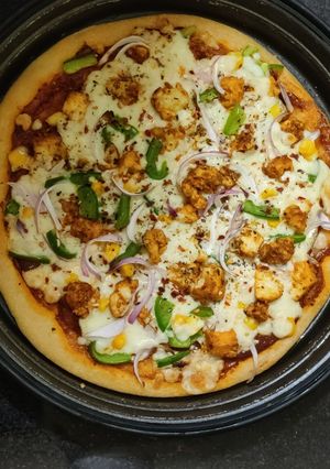 A picture of Paneer Veggie Delite Pizza.