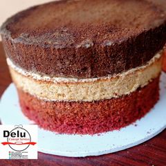 A picture of 3 flavors Cake (CHOCOLATE, VANILLA, RED VELVET CAKES).