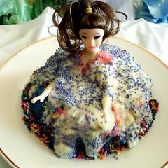 A picture of Triple layered doll cake.