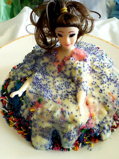 A picture of Triple layered doll cake.