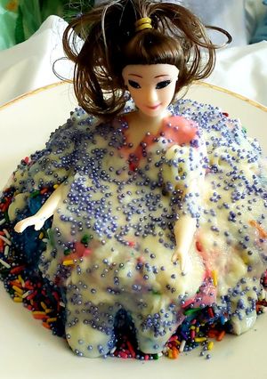 A picture of Triple layered doll cake.