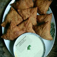 Whole wheat(gandum atta) samosay with green raita chutni A picture of Whole wheat(gandum atta) samosay with green raita chutni.