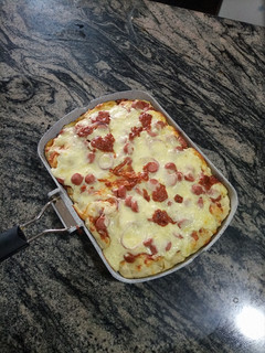 A picture of Mozeralla and sausage Pizza.