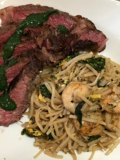 A picture of Ribeye Mint Chutney Sauce w/ Shrimp Pad Thai.