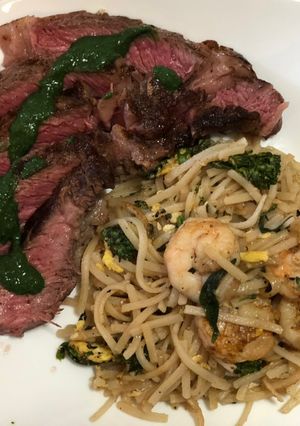 A picture of Ribeye Mint Chutney Sauce w/ Shrimp Pad Thai.