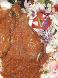 A picture of Just salad and chicken stew.