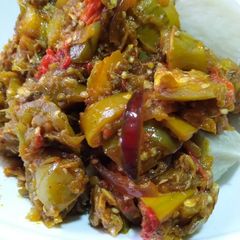 A picture of Garden egg sauce with yam.