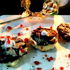 A picture of Tart filled with 2 chocolate sauce.
