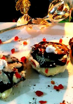 A picture of Tart filled with 2 chocolate sauce.