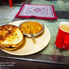 A picture of Leftover chana with kulcha and tea.