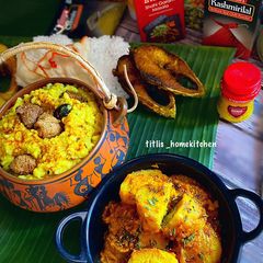A picture of Stuffed Aloo Dum in Cholar Daal Gravy.