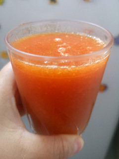 Una foto de Jugo de papaya con algarrobina