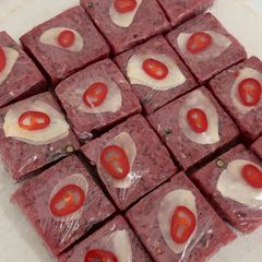 A picture of “Nem Chua” Raw Fermented Beef.