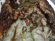 A picture of grilled fish vegetable rice