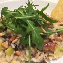 A picture of Risotto with leeks, mushrooms & Parmesan crisps.