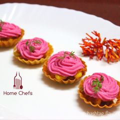 A picture of Corn Canapés with Pink frost.