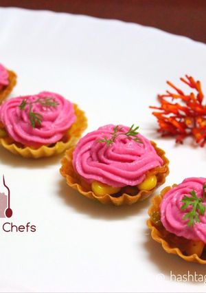 A picture of Corn Canapés with Pink frost.
