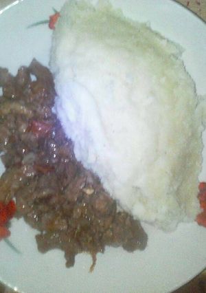 A picture of Ugali served with filed beef.