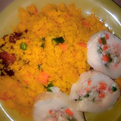 A picture of Couscous jollop with veggies and egg.