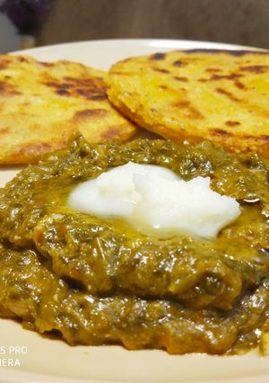 A picture of Sarso Saag with Makki Roti.