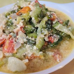 A picture of Savory Sautéed Bitter Gourd with Tomatoes / Ampalaya / Bitter Melon.