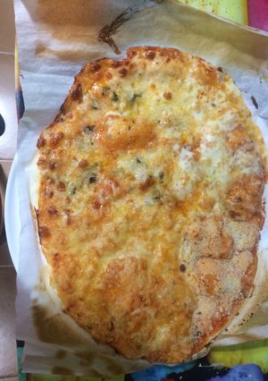 Una foto de Pizza 4 quesos