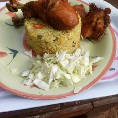 A picture of Fried rice and chicken.