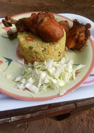 A picture of Fried rice and chicken.