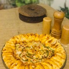 A picture of Roasted meat braided pizza.