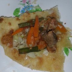 A picture of Chappati and meat stew.