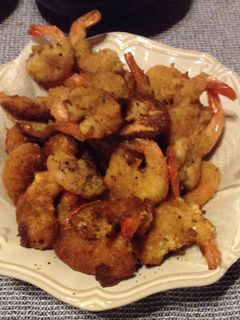 Una foto de Camarones apanados