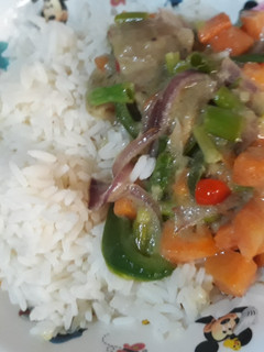 A picture of Vegetable sauce with rice.