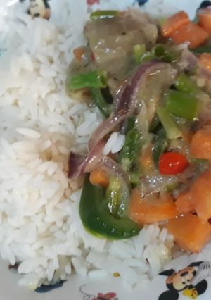 A picture of Vegetable sauce with rice.