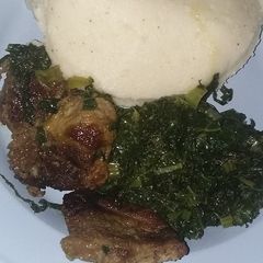 Covo and fried beef serve with pap A picture of Covo and fried beef serve with pap.