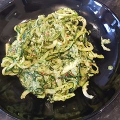 A picture of Courgette spaghetti with pesto without cheese.