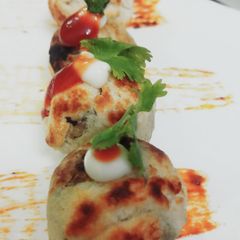 A picture of Stuffed Cheesy Mushroom In Appam Mould.