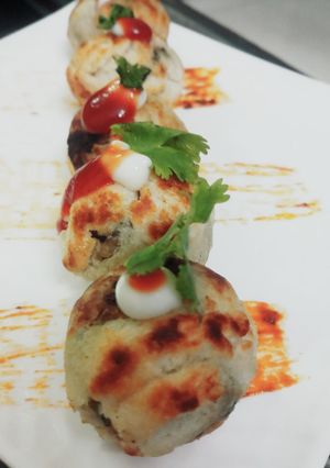 A picture of Stuffed Cheesy Mushroom In Appam Mould.