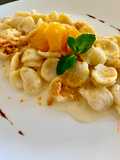ORECCHIETTE CREMA DI RICOTTA AROMATIZZATA AGLI AGRUMI, ARANCIA CARAMELLATA, CRUMBLE DI FRISELLA