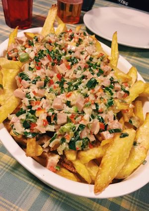 Una foto de Papas con crema y verdeo